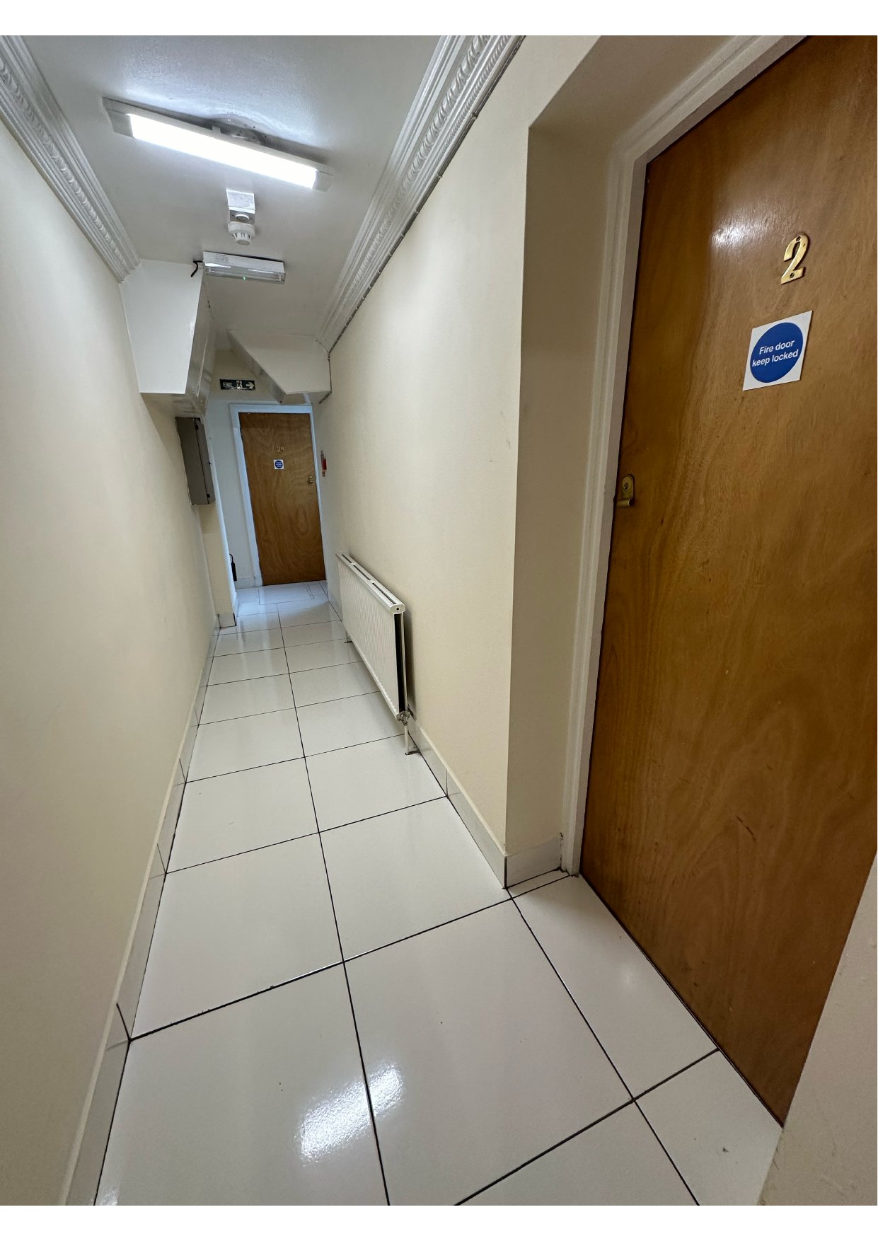 Fire doors along a shared HMO corridor serving individual tenant bedrooms