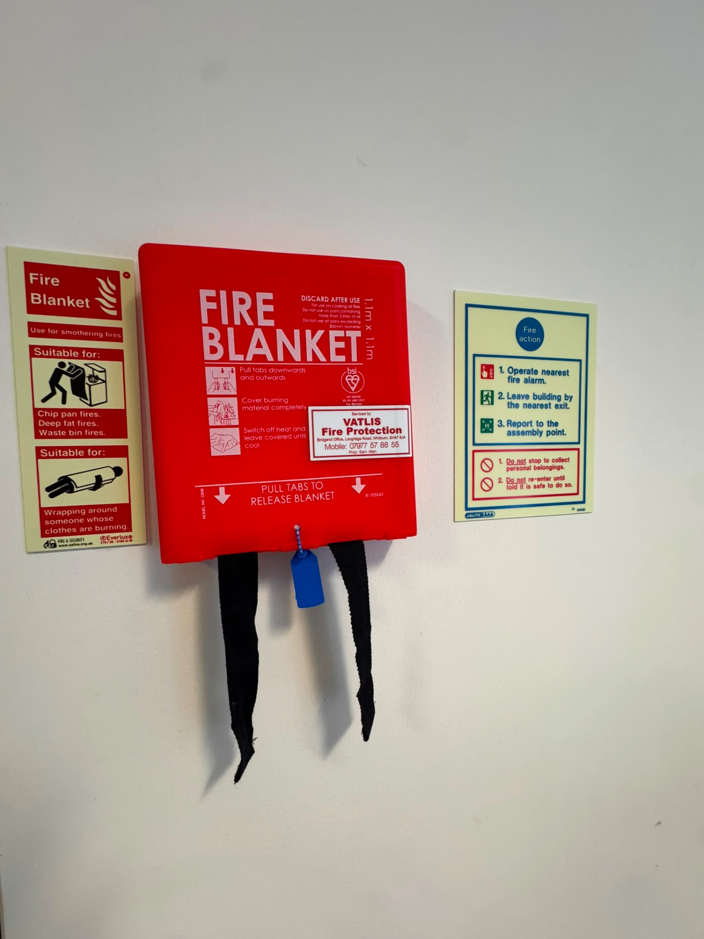 Fire blanket, fire blanket signage and fire action notice in a pub kitchen