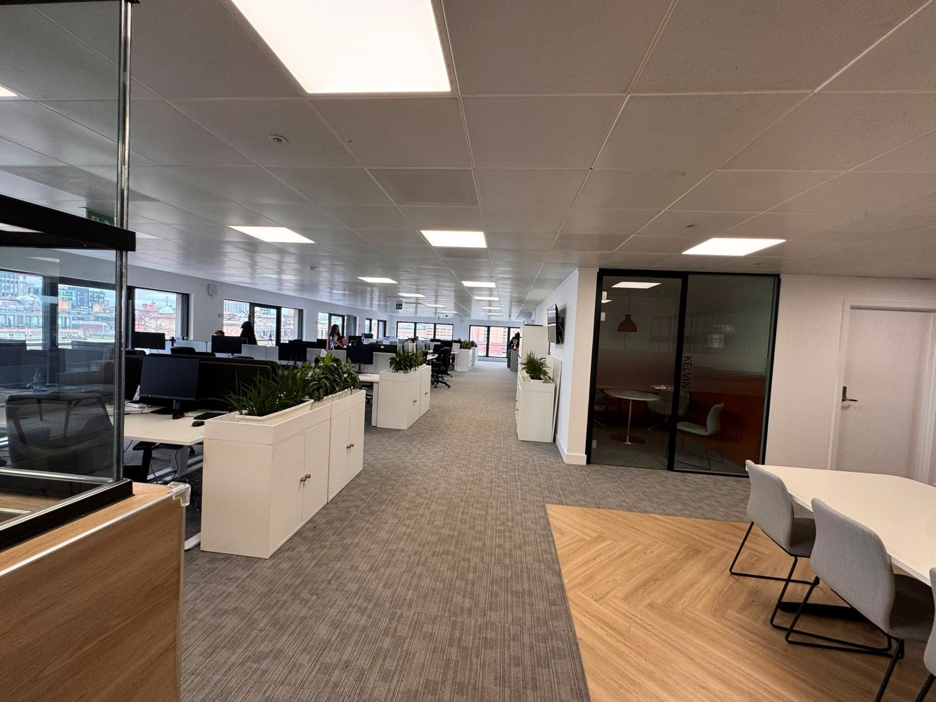 Open-plan tenant office floor with escape route through to the final exit