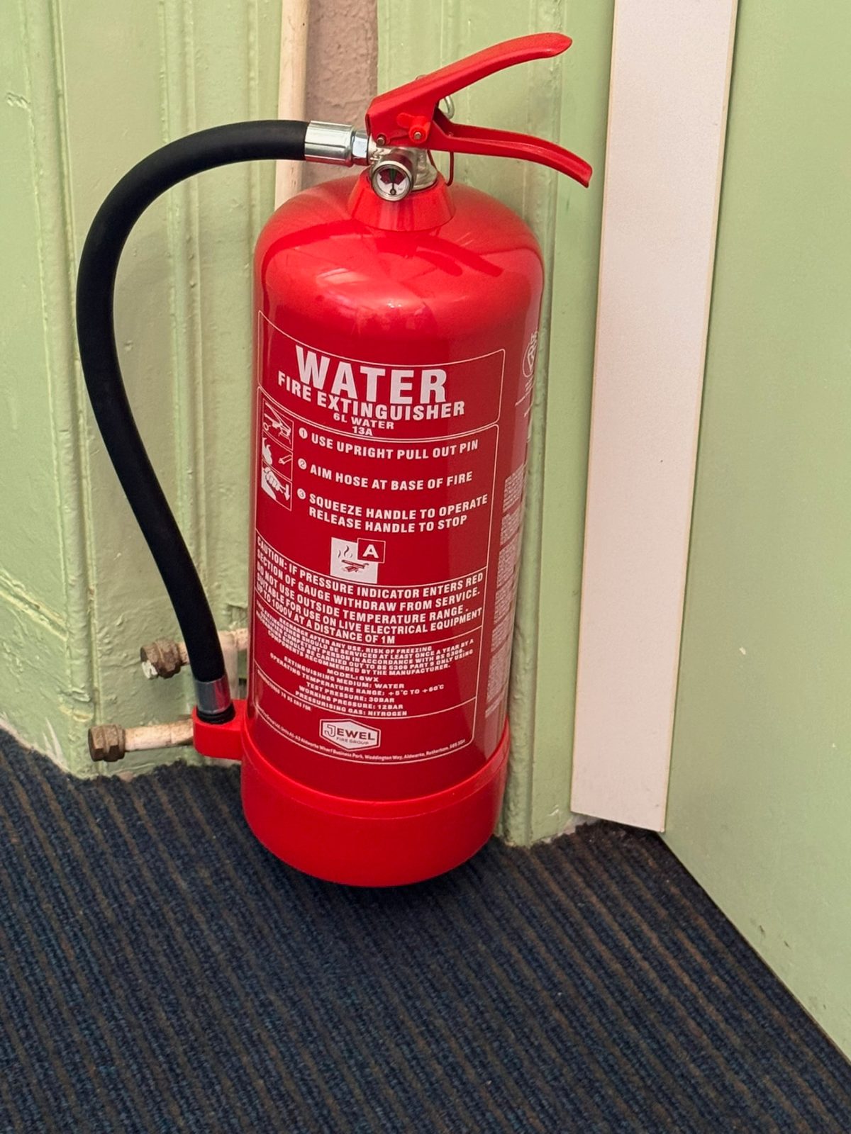Serviced water fire extinguisher in a commercial building