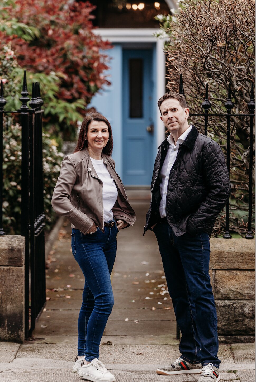 Nick and Caroline, founders of Fire Check Scotland, outside an Edinburgh townhouse